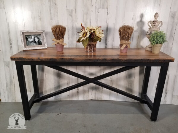 Barnwood console table with rectangular barnwood top on a welded steel base finished with an antiqued patina.