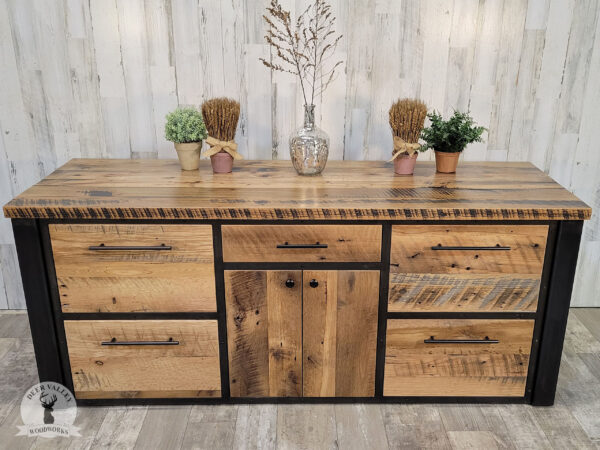 Rustic barnwood office credenza with a large barnwood countertop, four file drawers, center storage drawer with two barnwood doors underneath, and blackened industrial welded steel legs and frame.