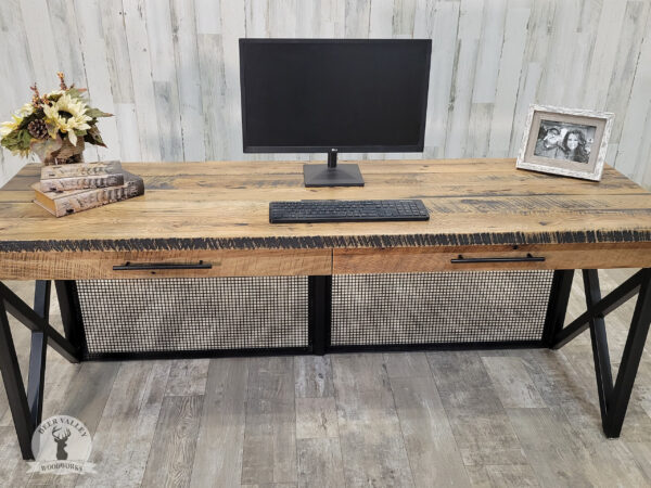 Urban industrial writing desk with reclaimed barnwood desktop with two pencil drawers, blackened steel frame and steel mesh panel in the front.
