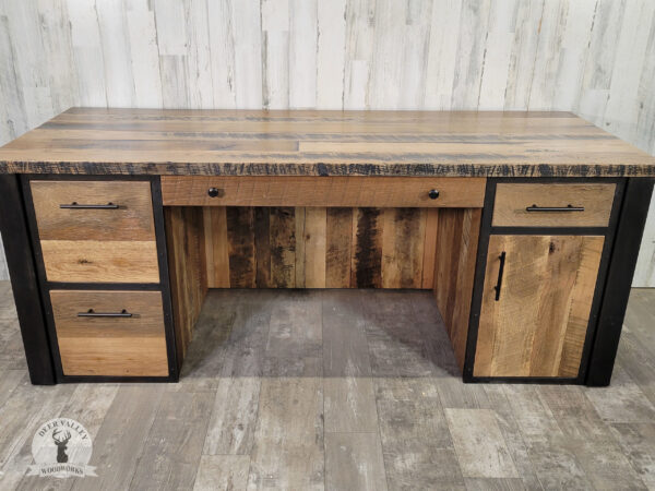 Rustic authentic barnwood executive desks with a large barnwood desktop, center lap drawer, two file drawers, supply drawer and barndoor opening to vented compartment, with an antiqued blackened welded steel legs and framework.