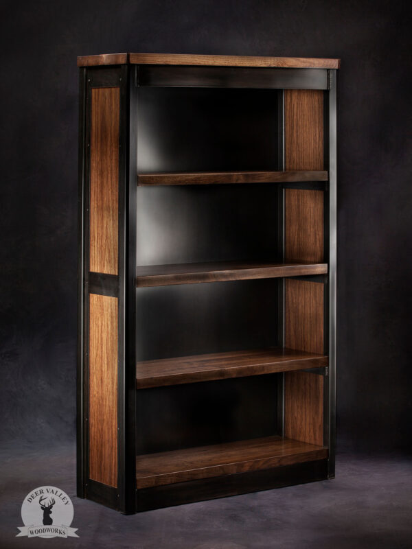 Industrial free-standing bookshelf with five heavy duty walnut shelves enclosed with a blackened metal back panel, and walnut side panels sat inside a welded metal framework.
