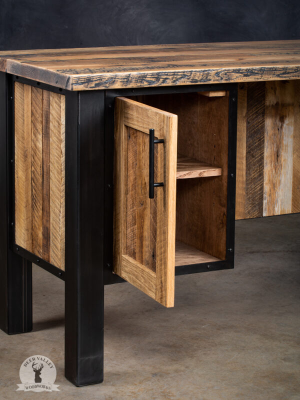 Closeup view of the open storage cabinet in our rustic barnwood corner desk, highlighting its sturdy construction and beautiful characteristics of the barnwood.