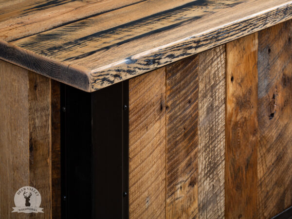 Closeup view of the corner detail in our rustic barnwood corner desk, highlighting its sturdy construction and beautiful characteristics of the barnwood