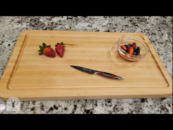 Rock-hard maple cutting board is close-grained wood and juice grooves.