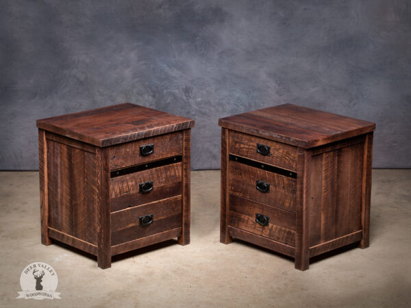Pair of rustic reclaimed barnwood end tables with a stained satin glass urethane finish and each table has three drawers, each with a black drawer pull.
