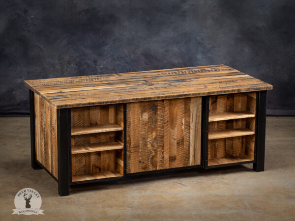 Industrial barnwood executive’s desk with a large desktop, modesty panels, display shelves and a blackened welded steel frame.
