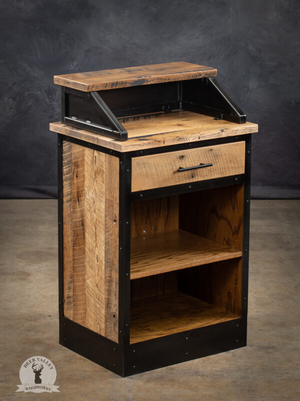 Rustic barnwood host stand with transaction counter, drawer and two open storage shelves surrounded by antique blackened welded steel.